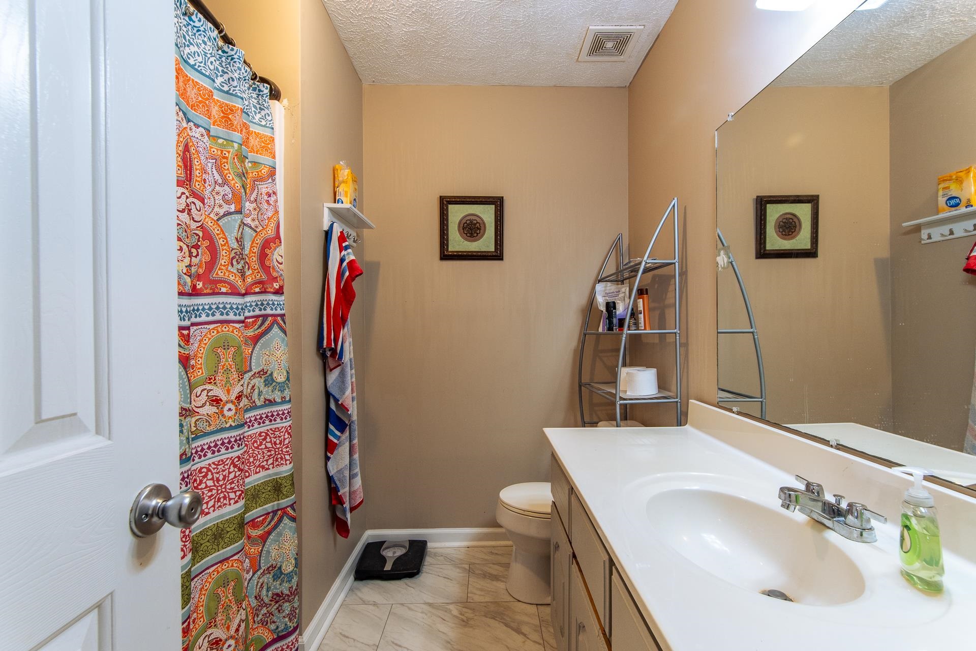 5584 Ramer Selmer Road Selmer, TN 38375 - Photo 18 of 31 a bathroom with a sink and a mirror