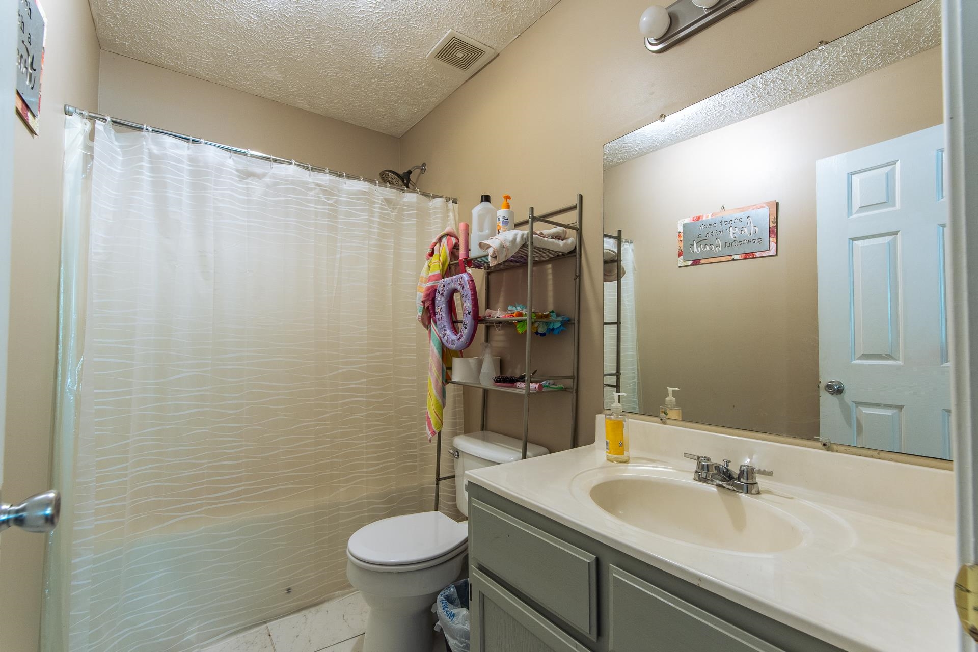 5584 Ramer Selmer Road Selmer, TN 38375 - Photo 20 of 31 a bathroom with a sink and a mirror