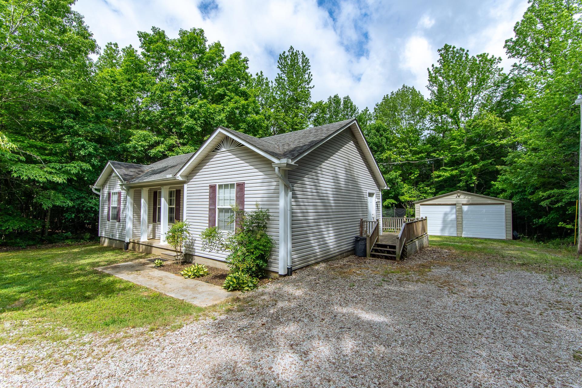 5584 Ramer Selmer Road Selmer, TN 38375 - Photo 2 of 31 a front view of a house with garden