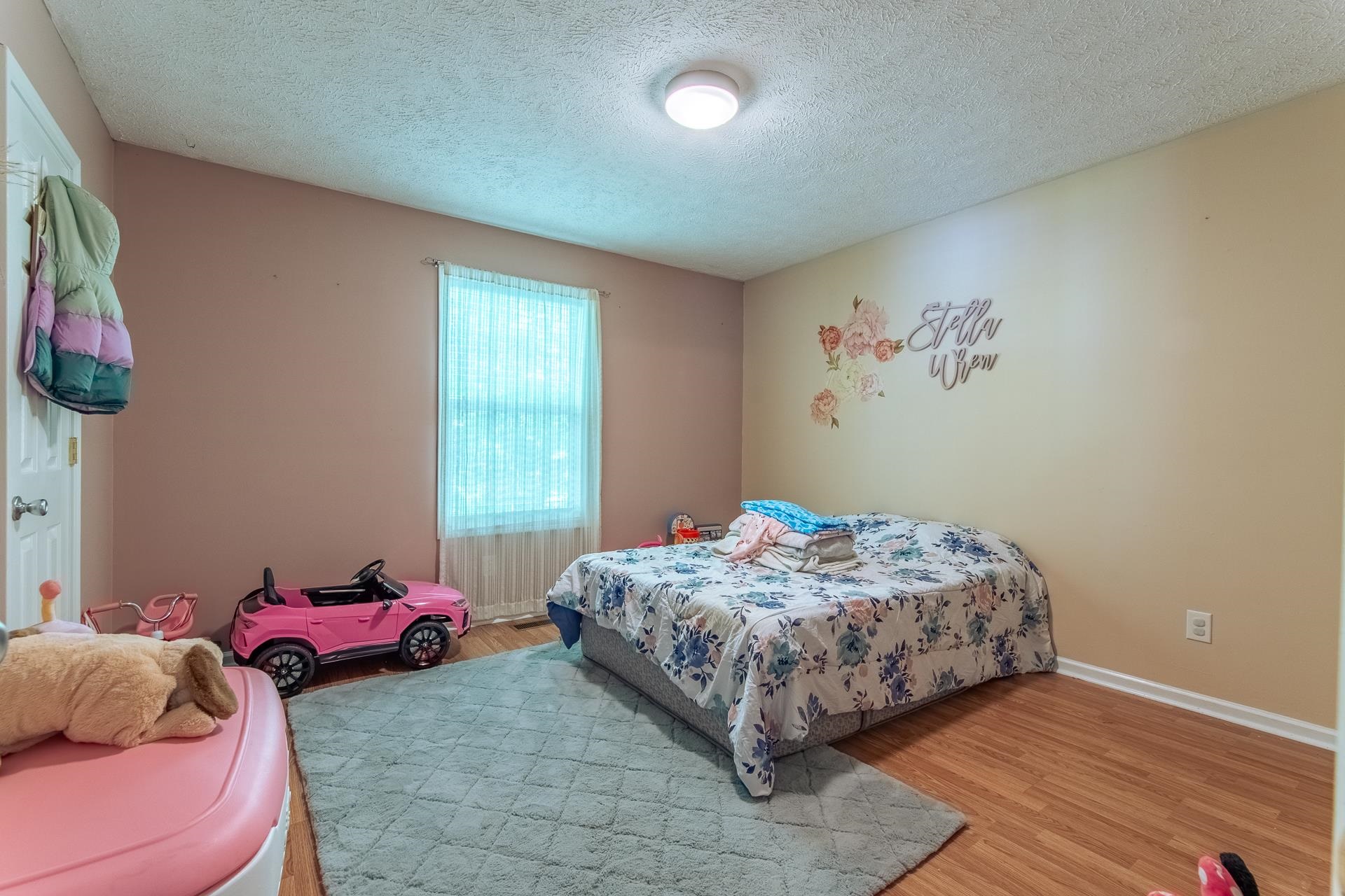5584 Ramer Selmer Road Selmer, TN 38375 - Photo 21 of 31 a bedroom with a bed and a window