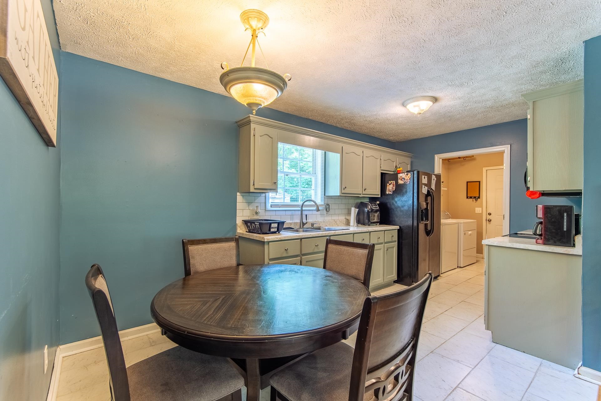 5584 Ramer Selmer Road Selmer, TN 38375 - Photo 23 of 31 a view of a dining room with furniture window and wooden floor