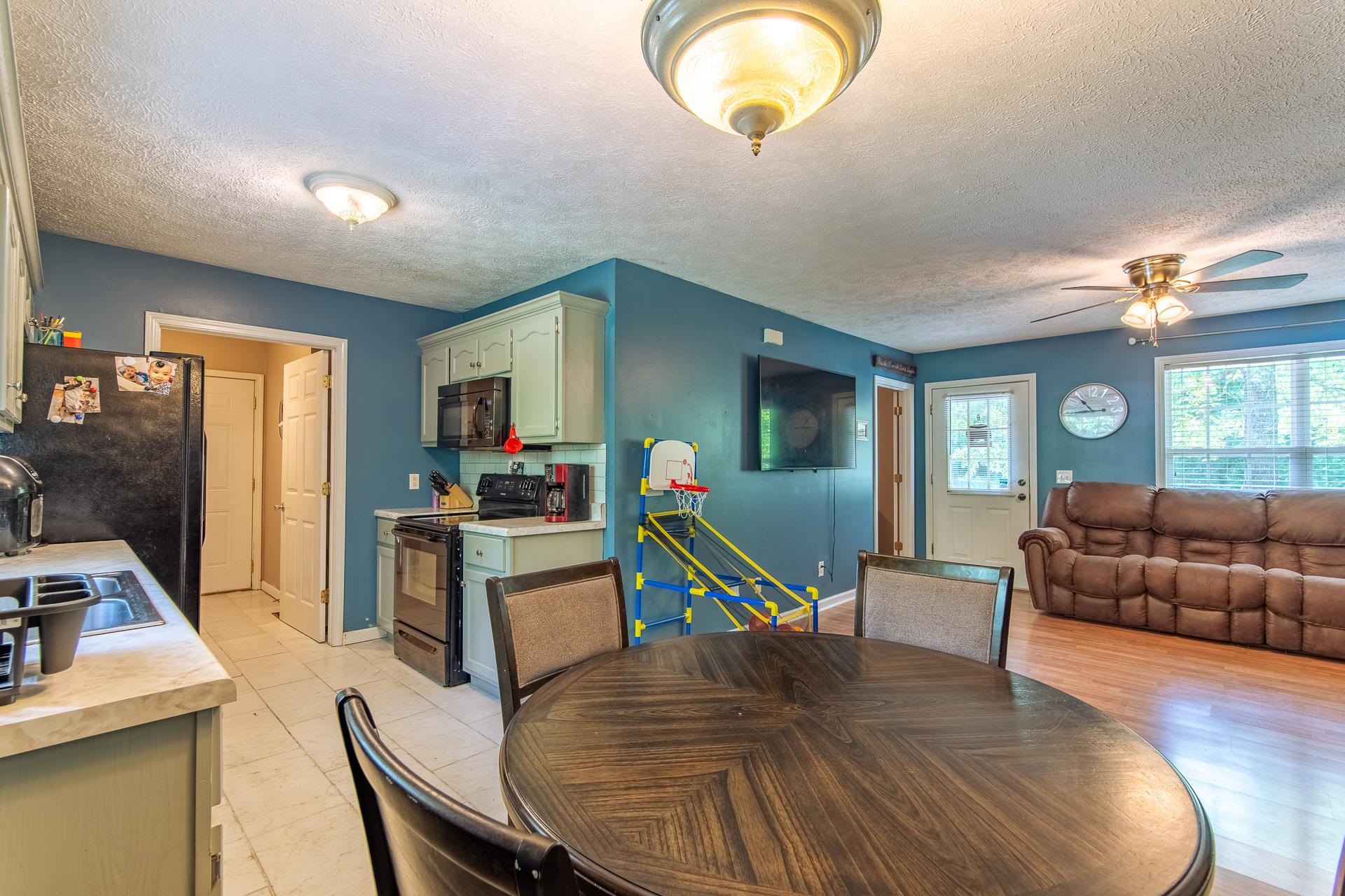 5584 Ramer Selmer Road Selmer, TN 38375 - Photo 25 of 31 a living room with furniture and a flat screen tv
