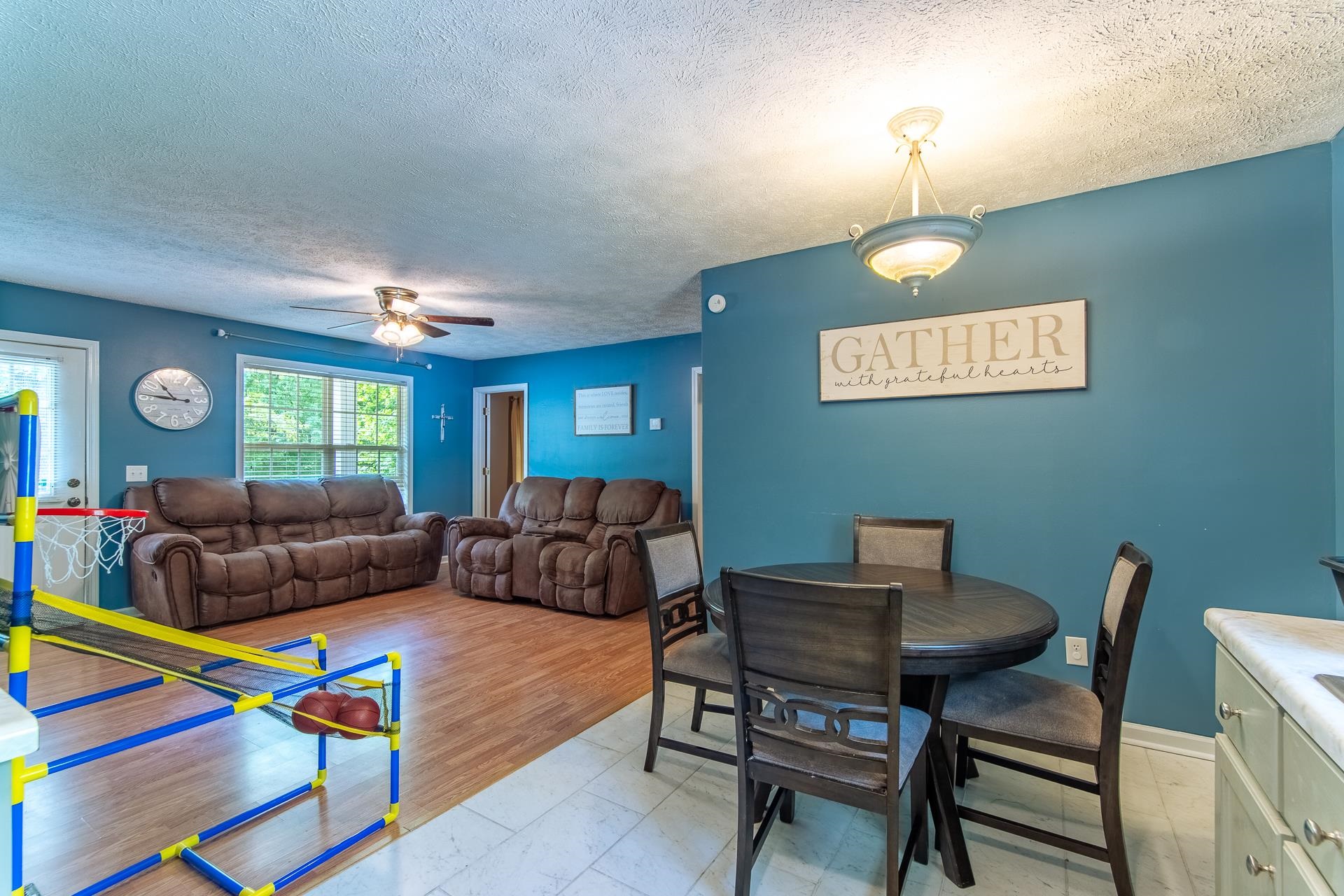 5584 Ramer Selmer Road Selmer, TN 38375 - Photo 30 of 31 a living room with furniture and a wooden floor