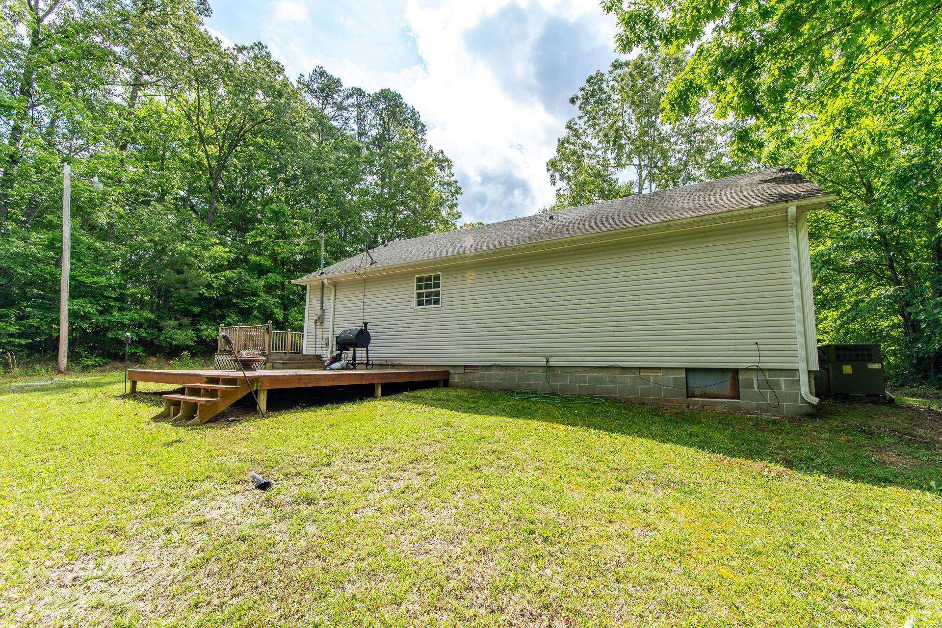 5584 Ramer Selmer Road Selmer, TN 38375 - Photo 5 of 31 a backyard of a house with table and chairs