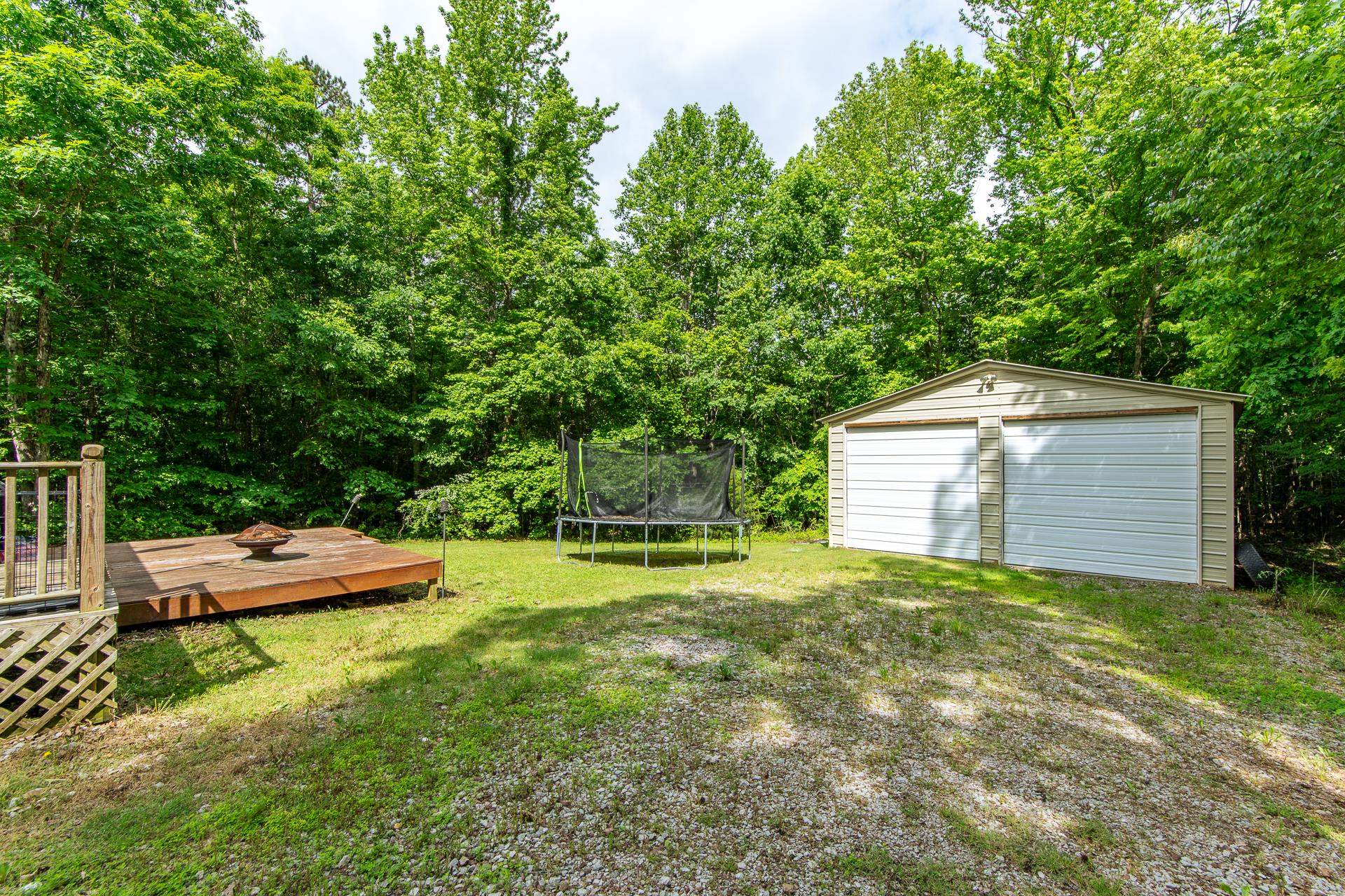 5584 Ramer Selmer Road Selmer, TN 38375 - Photo 7 of 31 a view of backyard of house with green space