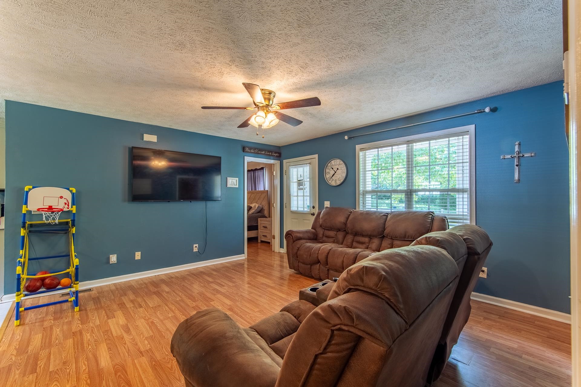 5584 Ramer Selmer Road Selmer, TN 38375 - Photo 8 of 31 a living room with furniture and a flat screen tv