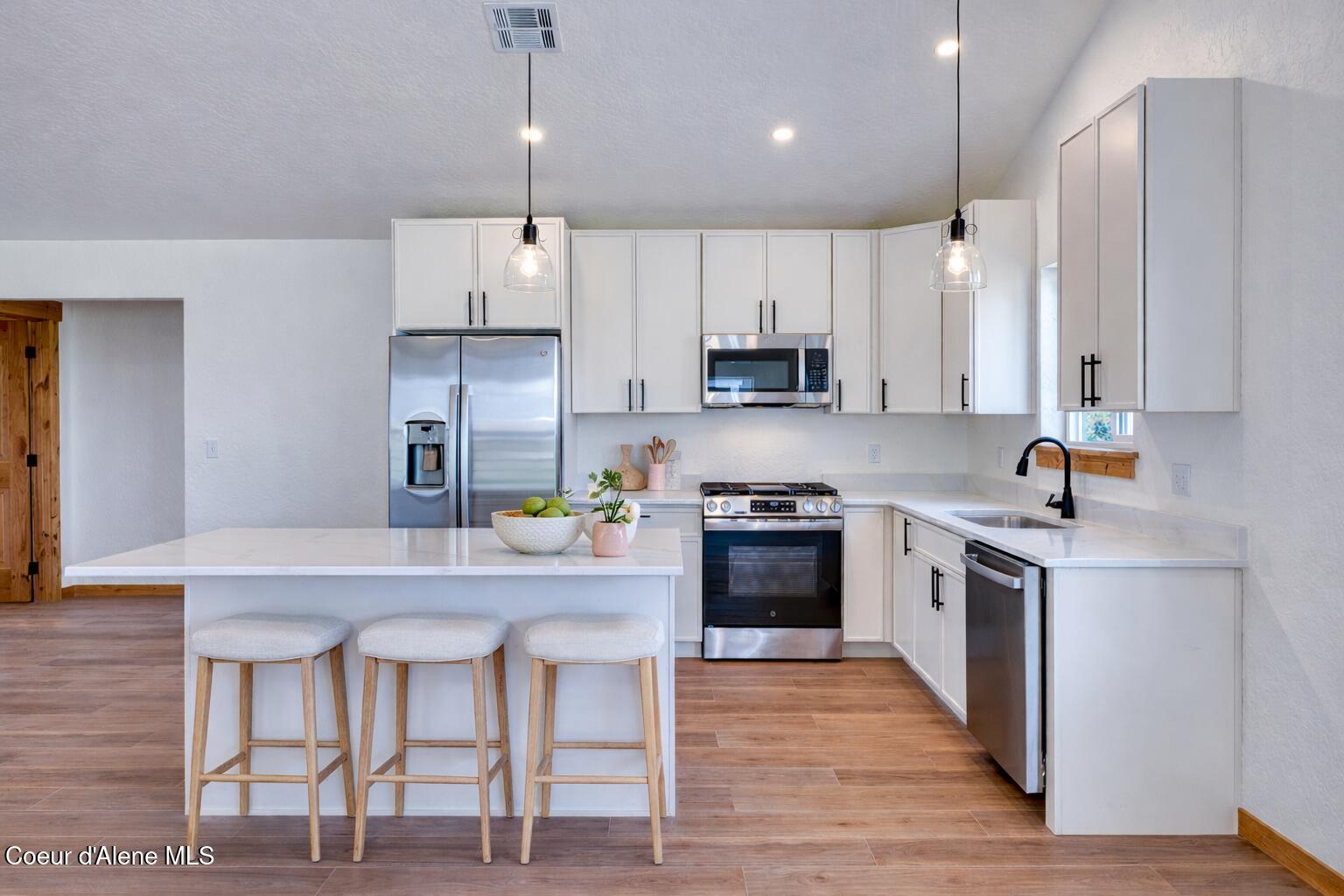 3264 Van Winkle Street Post Falls, ID 83854 - Photo 3 of 11 Modern kitchen with light wood accents
