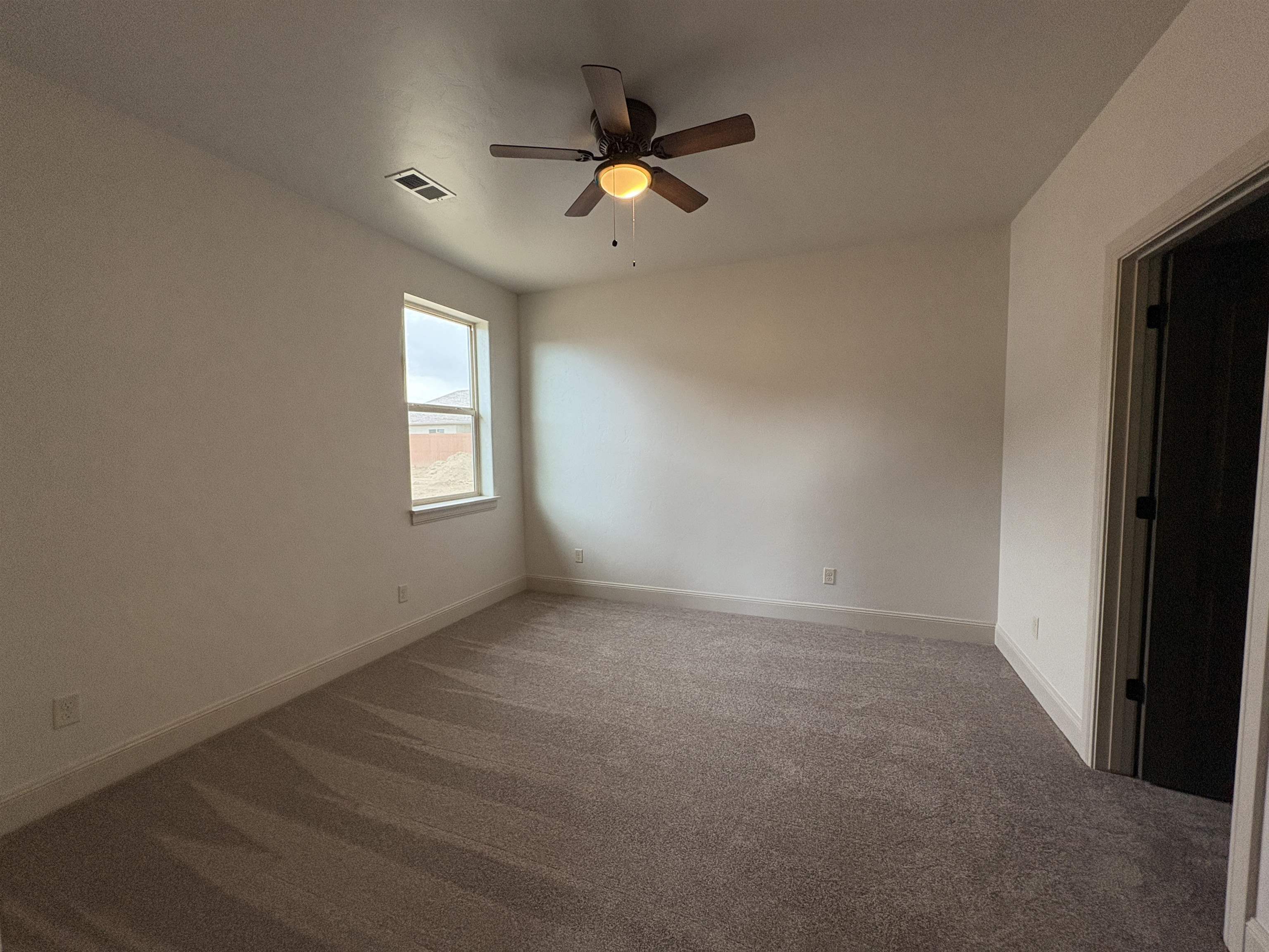 2641 Emerald Ridge Lane Grand Junction, CO 81506 - Photo 12 of 42 an empty room with closet and a ceiling fan