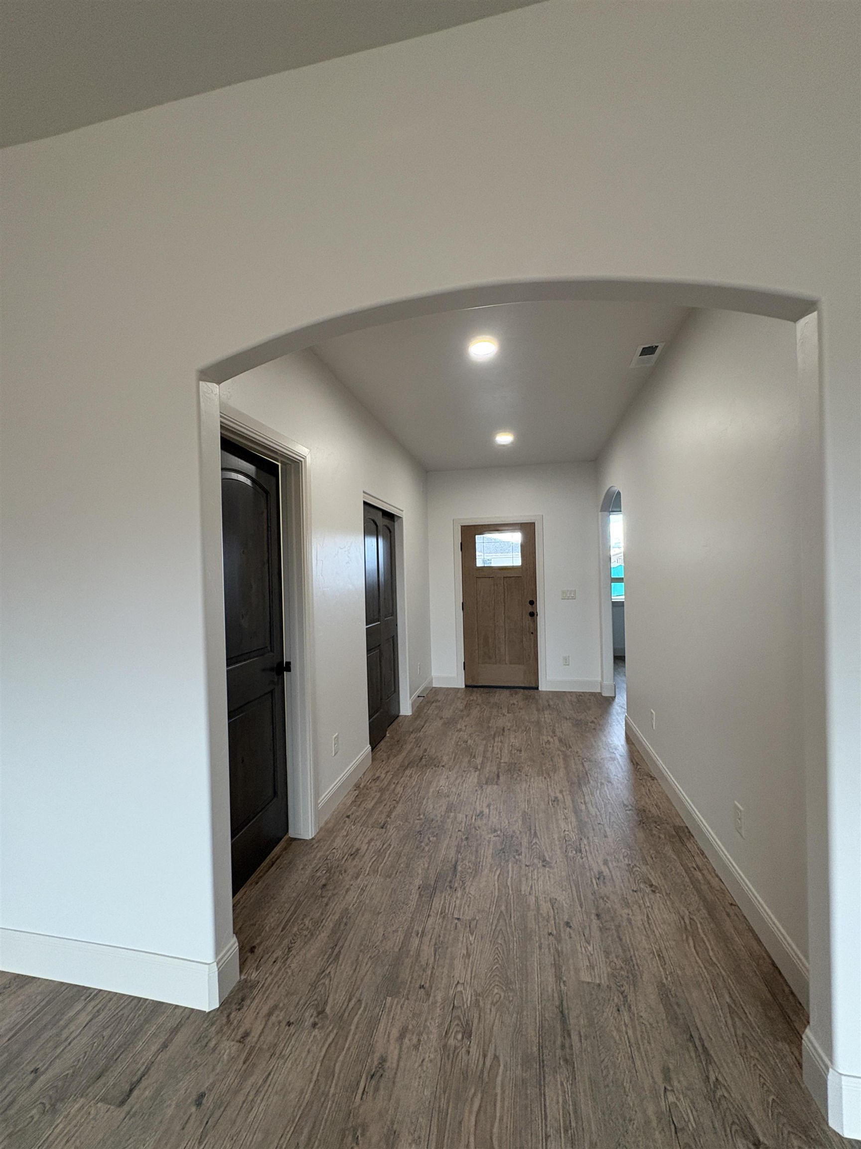 2641 Emerald Ridge Lane Grand Junction, CO 81506 - Photo 19 of 42 a view of a hallway with wooden floor