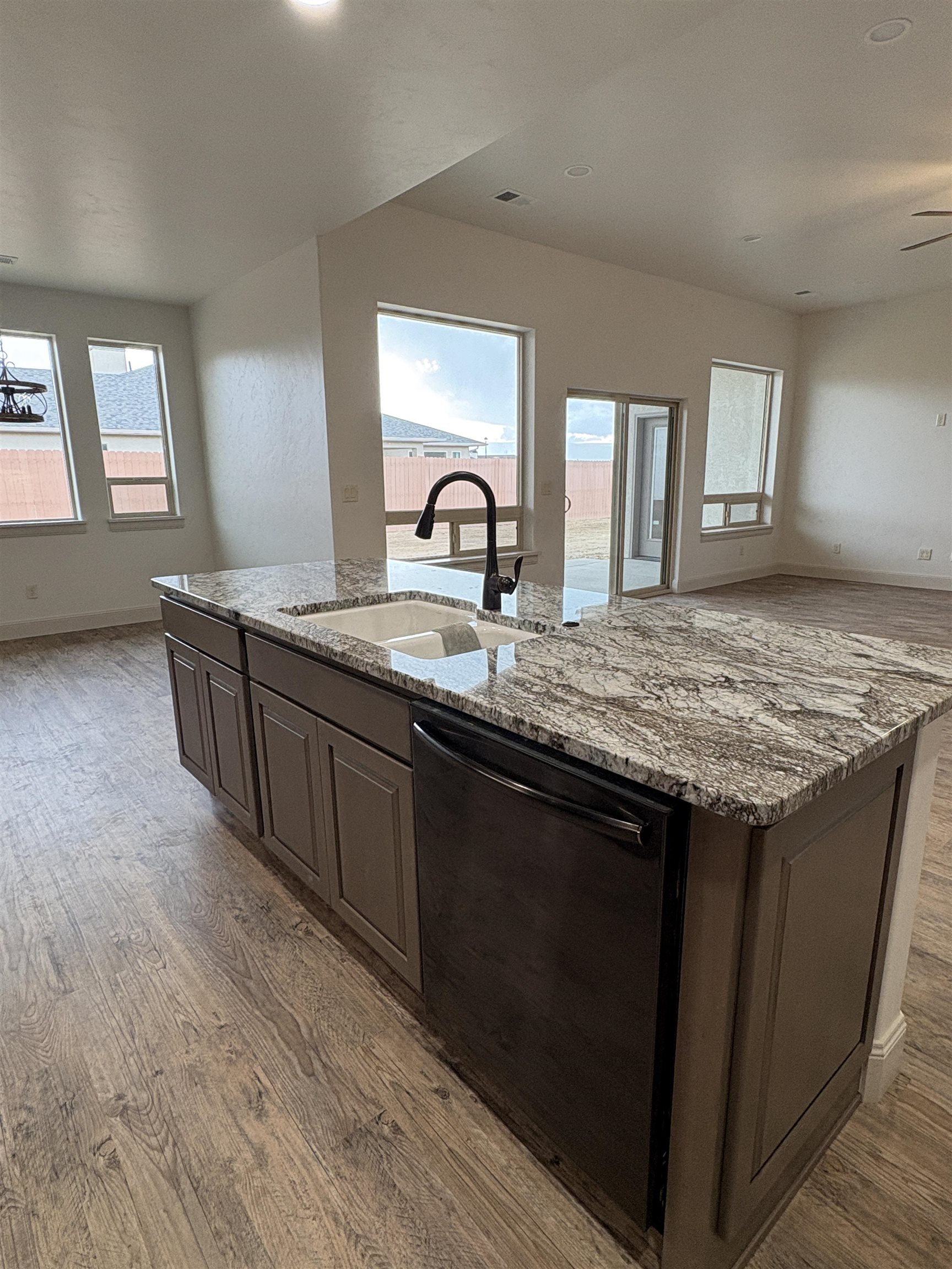 2641 Emerald Ridge Lane Grand Junction, CO 81506 - Photo 22 of 42 a kitchen with granite countertop a sink and cabinets