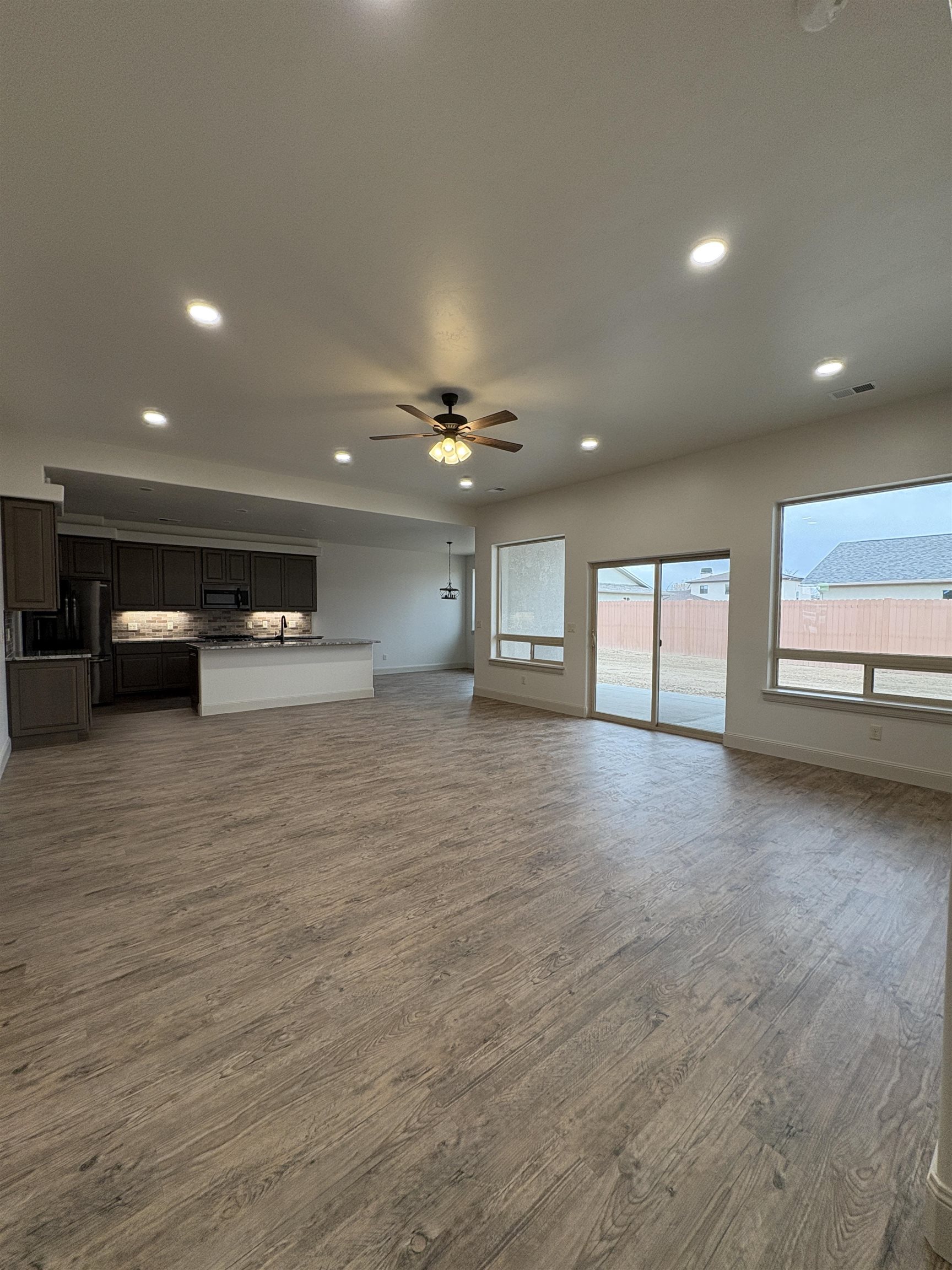 2641 Emerald Ridge Lane Grand Junction, CO 81506 - Photo 25 of 42 a view of a hall with kitchen and window