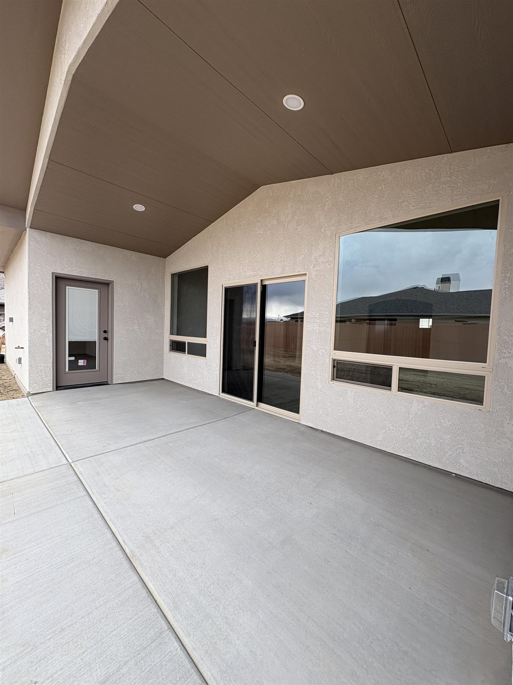 2641 Emerald Ridge Lane Grand Junction, CO 81506 - Photo 26 of 42 a view of an empty room with a fireplace and cabinet