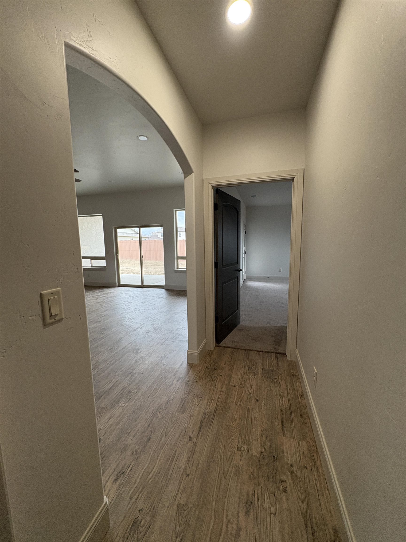 2641 Emerald Ridge Lane Grand Junction, CO 81506 - Photo 27 of 42 wooden floor in a hall with an empty room