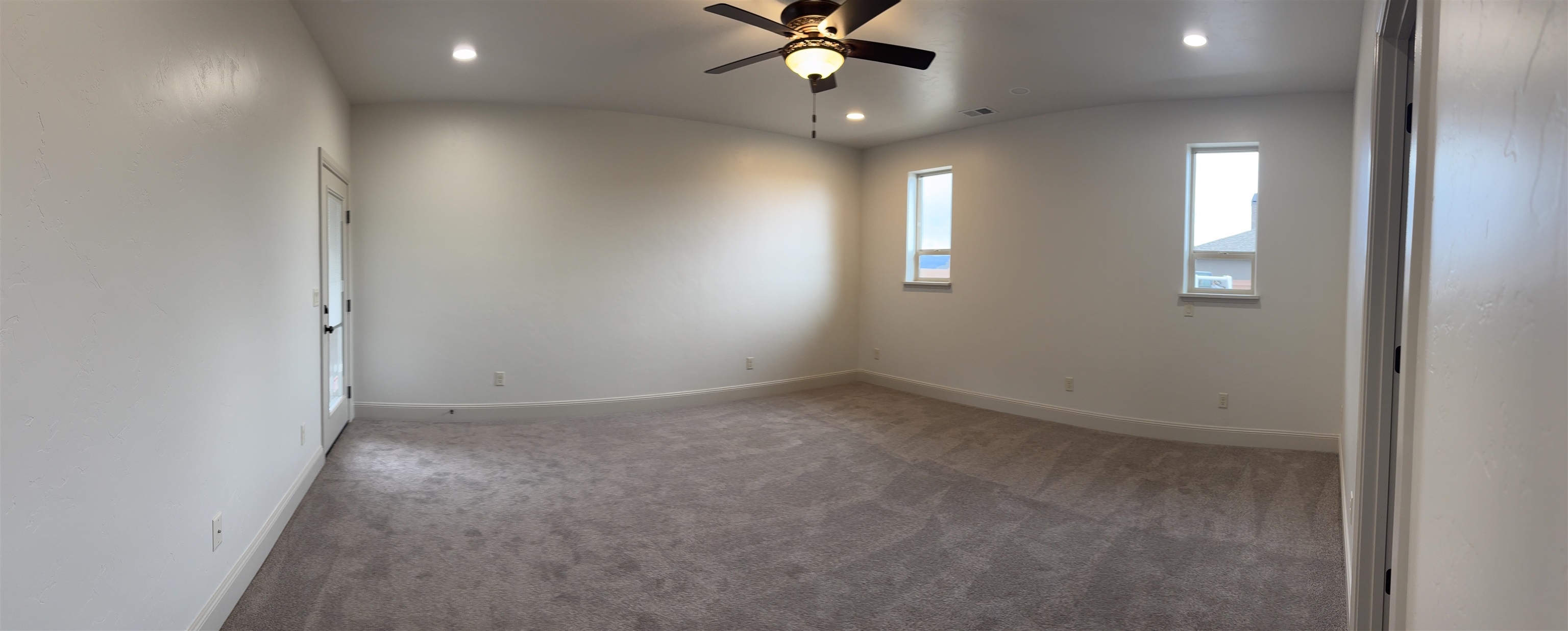2641 Emerald Ridge Lane Grand Junction, CO 81506 - Photo 28 of 42 an empty room with a window and a fan