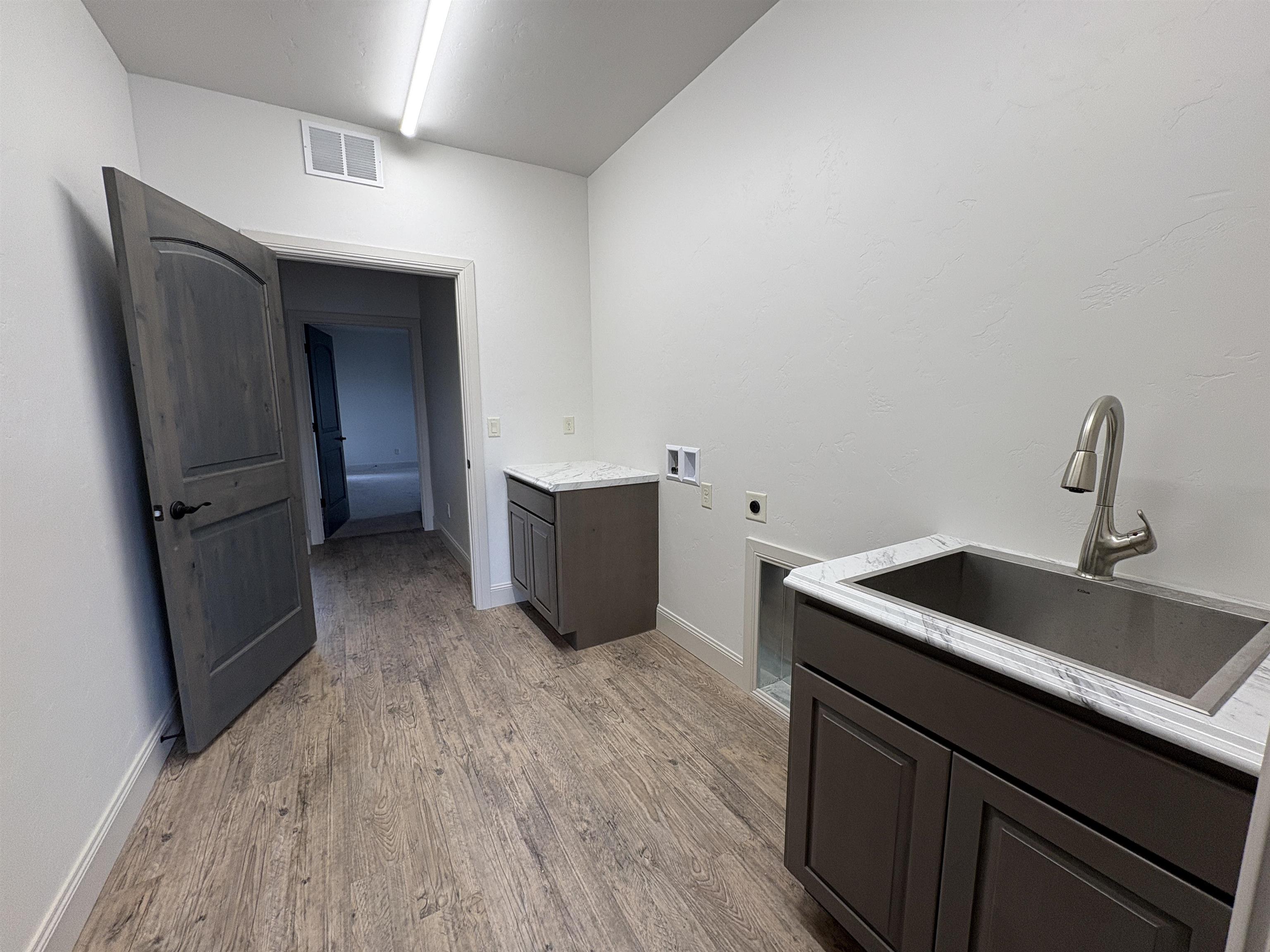 2641 Emerald Ridge Lane Grand Junction, CO 81506 - Photo 34 of 42 a kitchen with sink and refrigerator