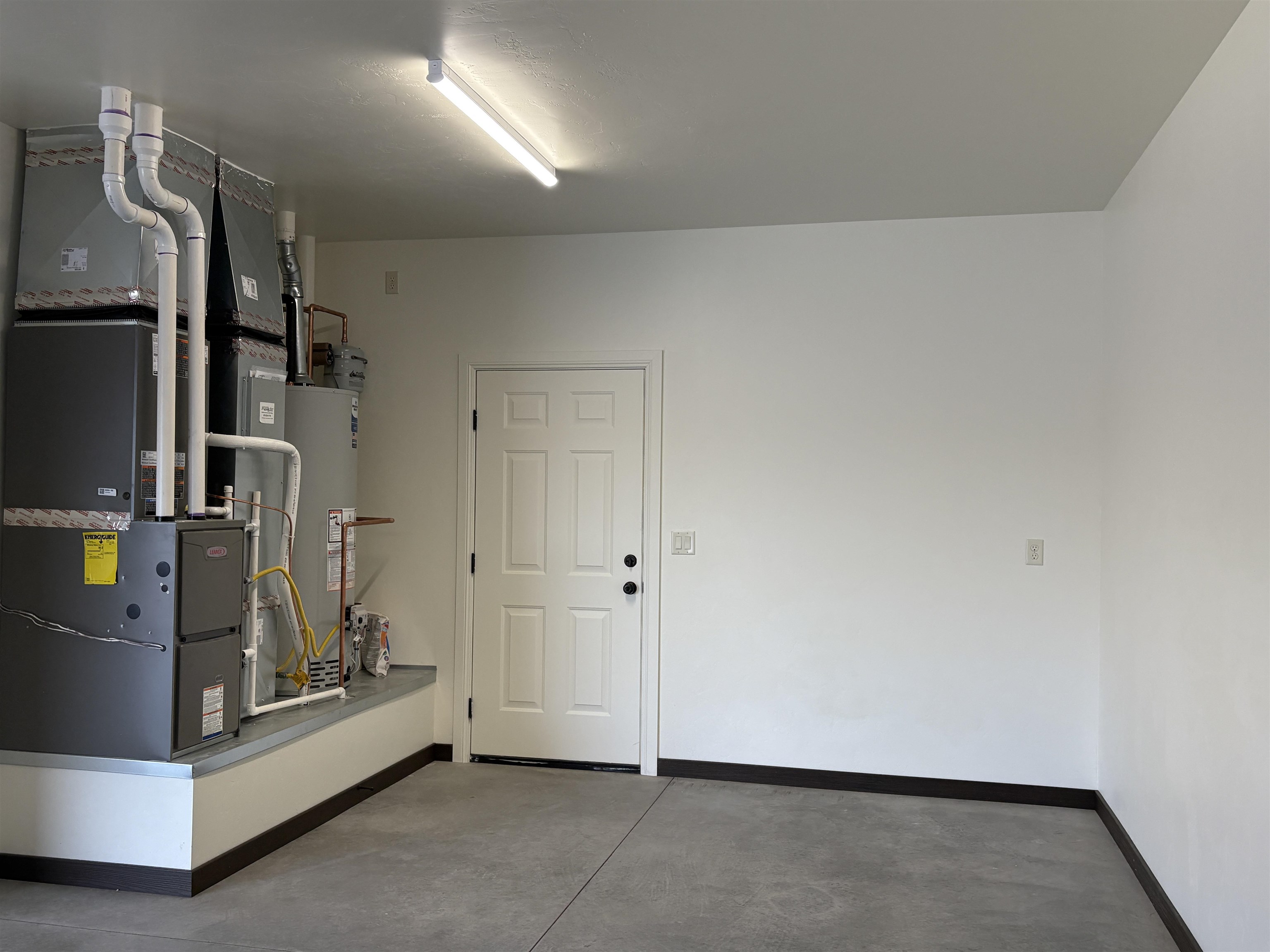 2641 Emerald Ridge Lane Grand Junction, CO 81506 - Photo 37 of 42 a view of a refrigerator in kitchen and an empty room