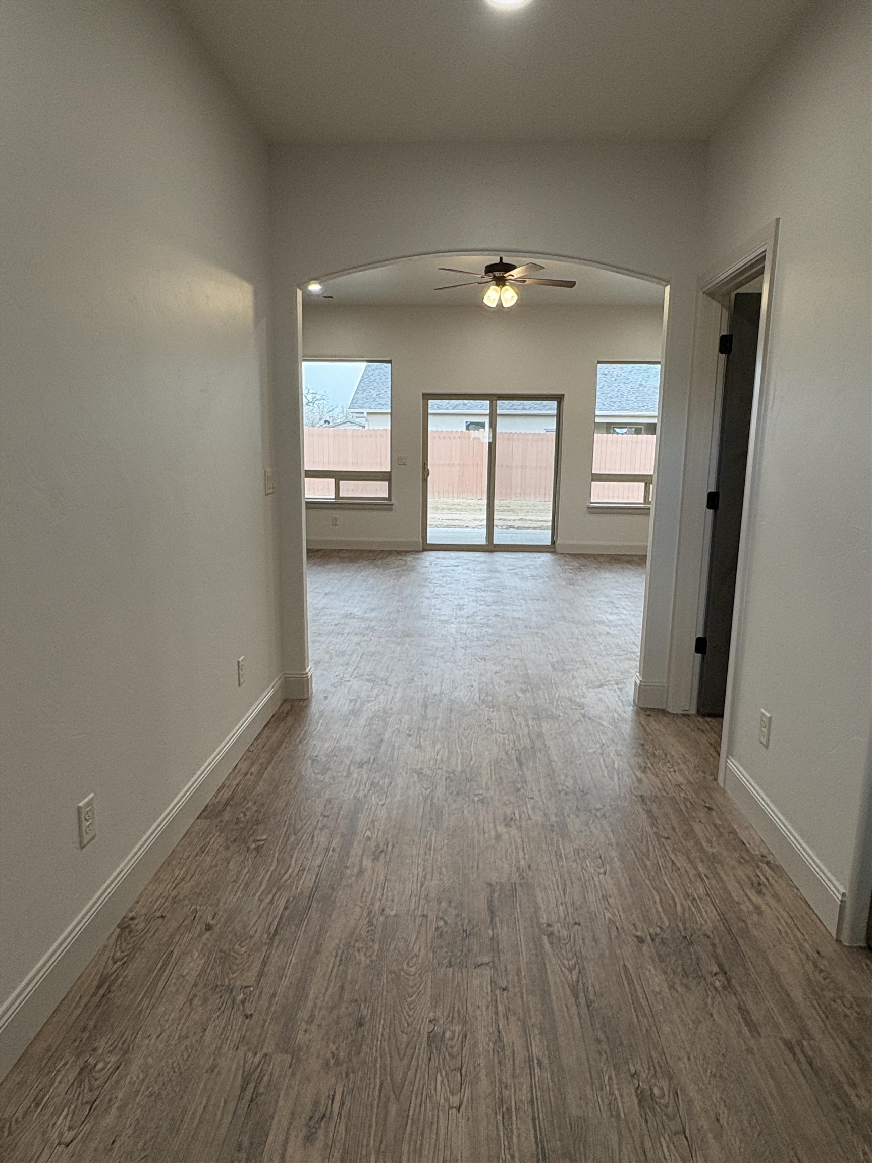 2641 Emerald Ridge Lane Grand Junction, CO 81506 - Photo 4 of 42 wooden floor in an empty room with a window