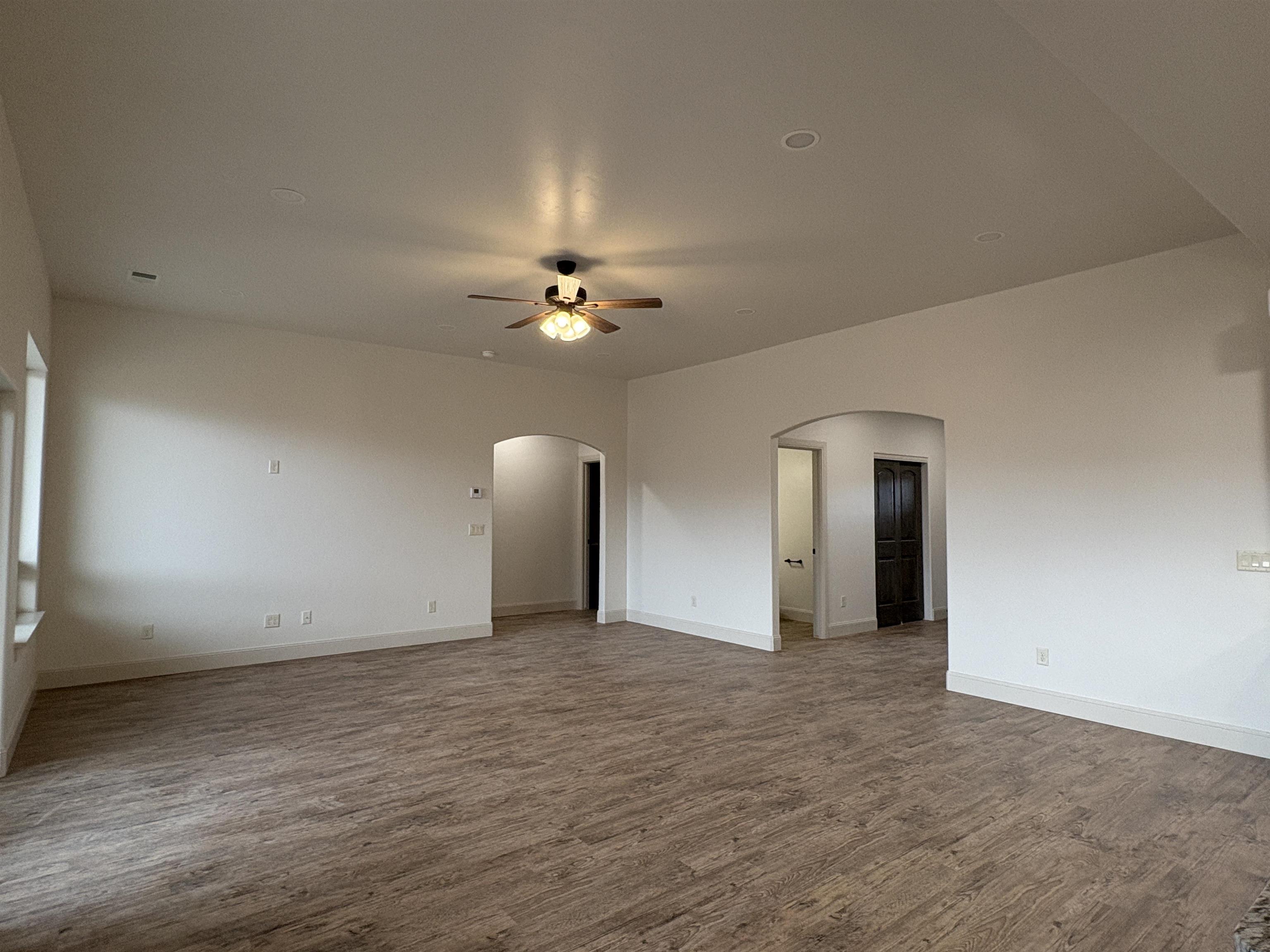 2641 Emerald Ridge Lane Grand Junction, CO 81506 - Photo 5 of 42 a view of an empty room with a chandelier fan