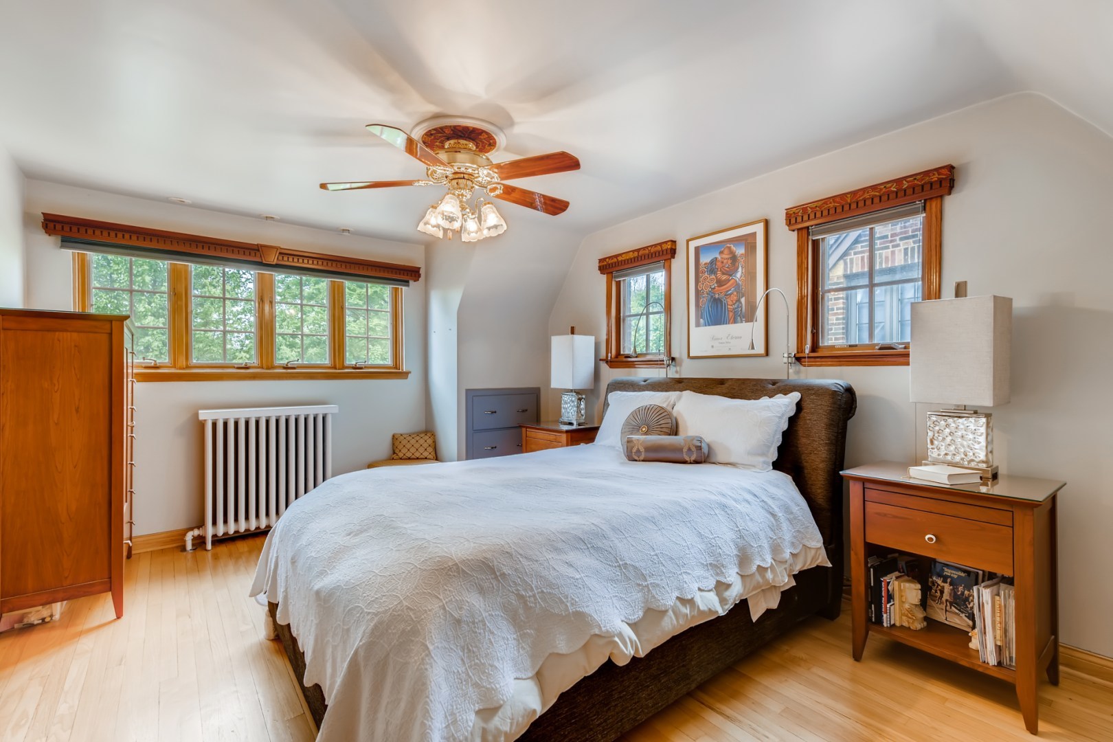 300 Blythe Road Riverside, IL 60546 - Photo 16 of 31 a bedroom with a bed and a chandelier