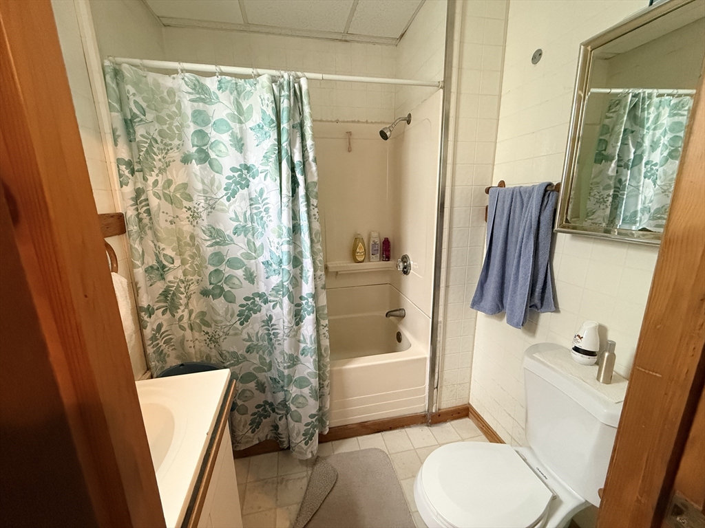 48 Tuttle Street Fall River, MA 02724 - Photo 15 of 16 a bathroom with a sink toilet and shower