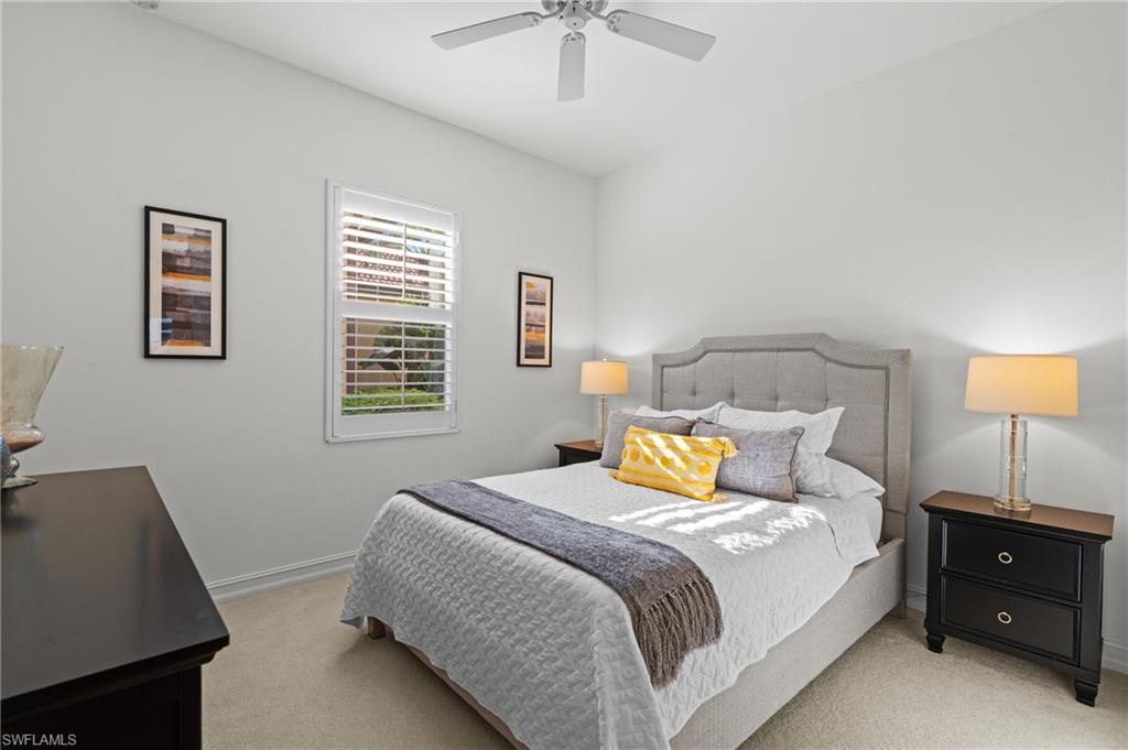 7806 Ashton Road Naples, FL 34113 - Photo 17 of 27 Bedroom with baseboards, a ceiling fan, and light colored carpet