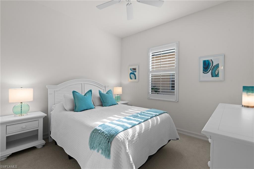 7806 Ashton Road Naples, FL 34113 - Photo 18 of 27 Bedroom featuring baseboards, light colored carpet, and ceiling fan