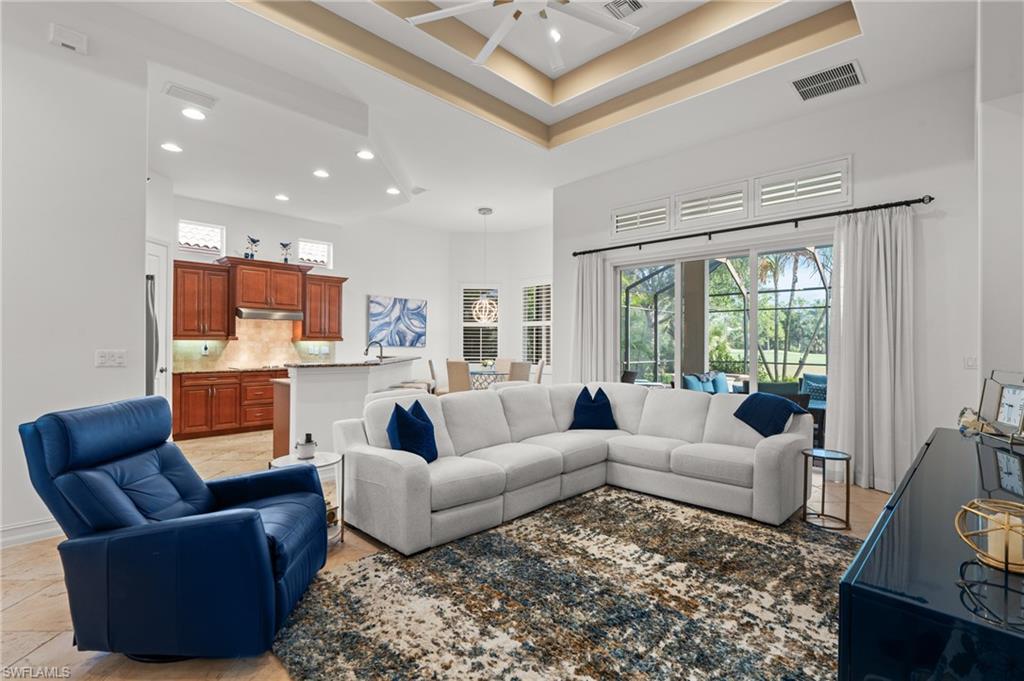 7806 Ashton Road Naples, FL 34113 - Photo 5 of 27 Living room featuring a high ceiling, recessed lighting, ceiling fan, and visible vents