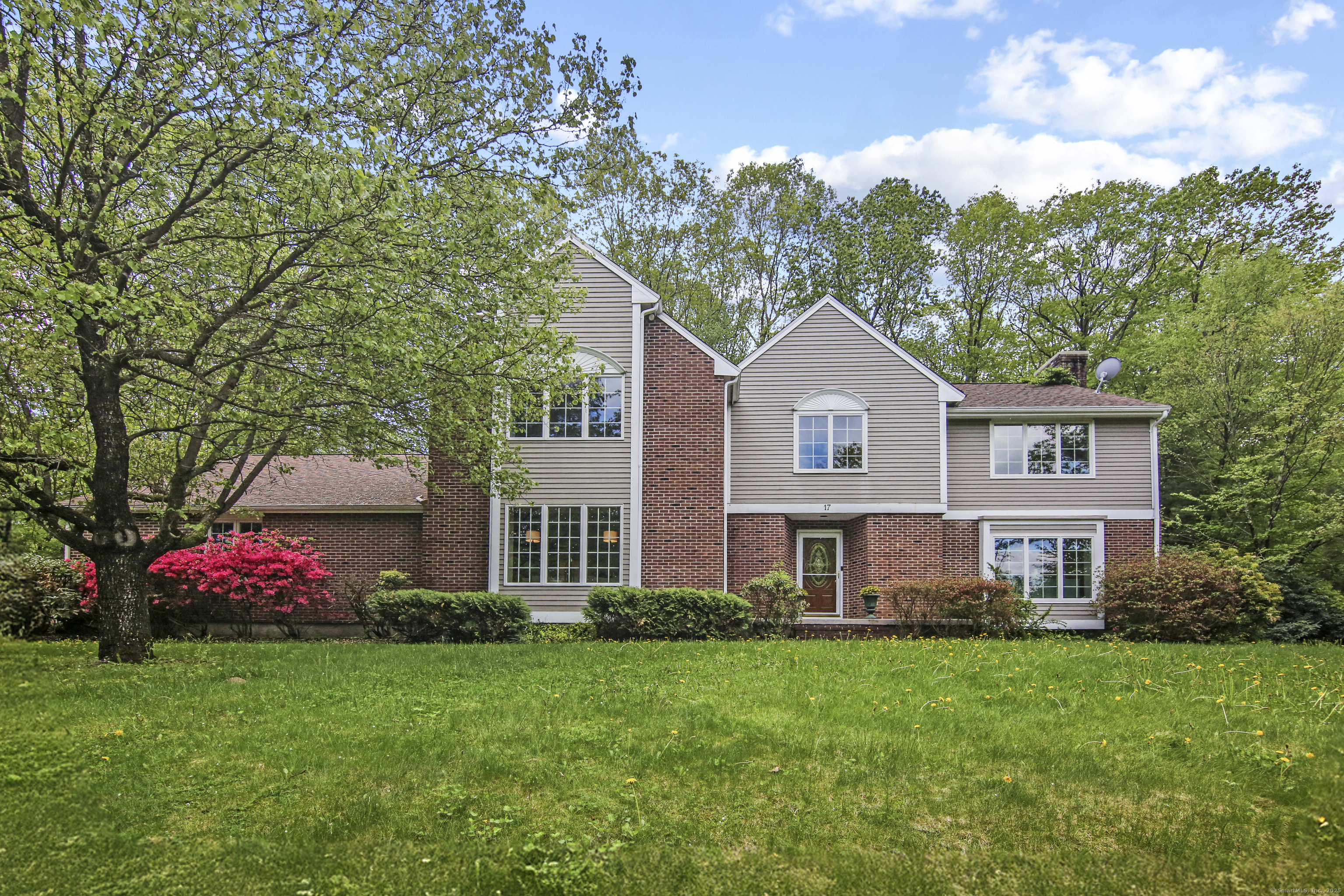 17 Fall Brook Avon, CT 06001 - Photo 1 of 1 a front view of a house with garden