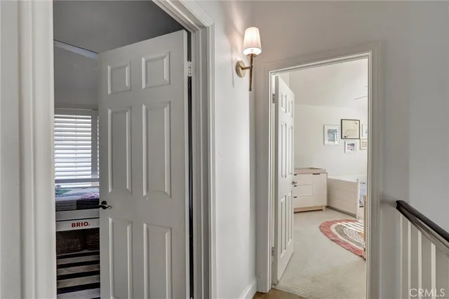 a view of a bedroom from a hallway