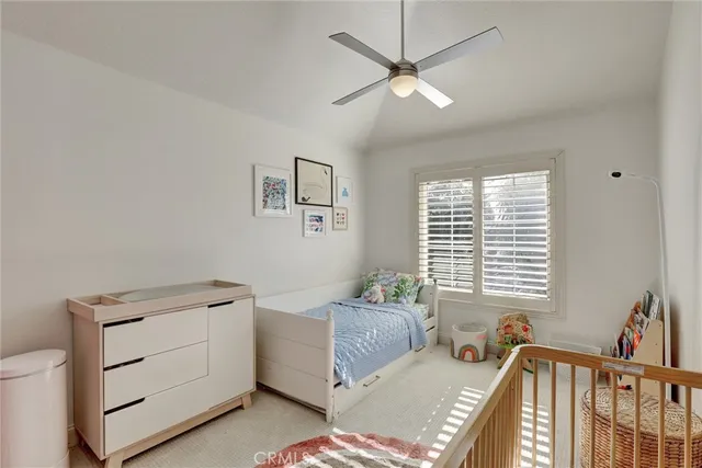 a bedroom with furniture and windows