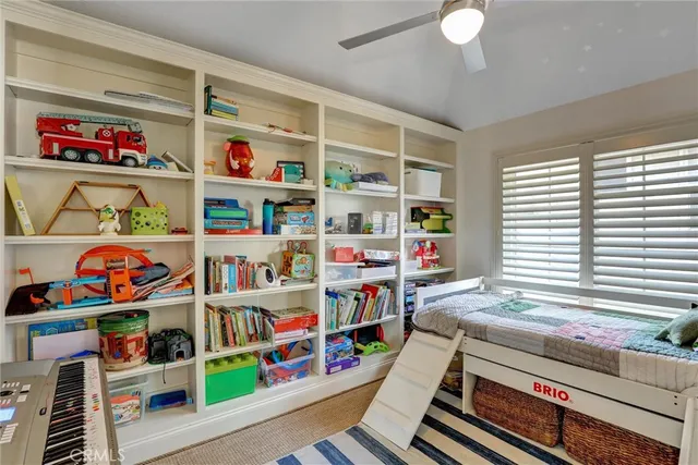 a room with toys and a book shelf