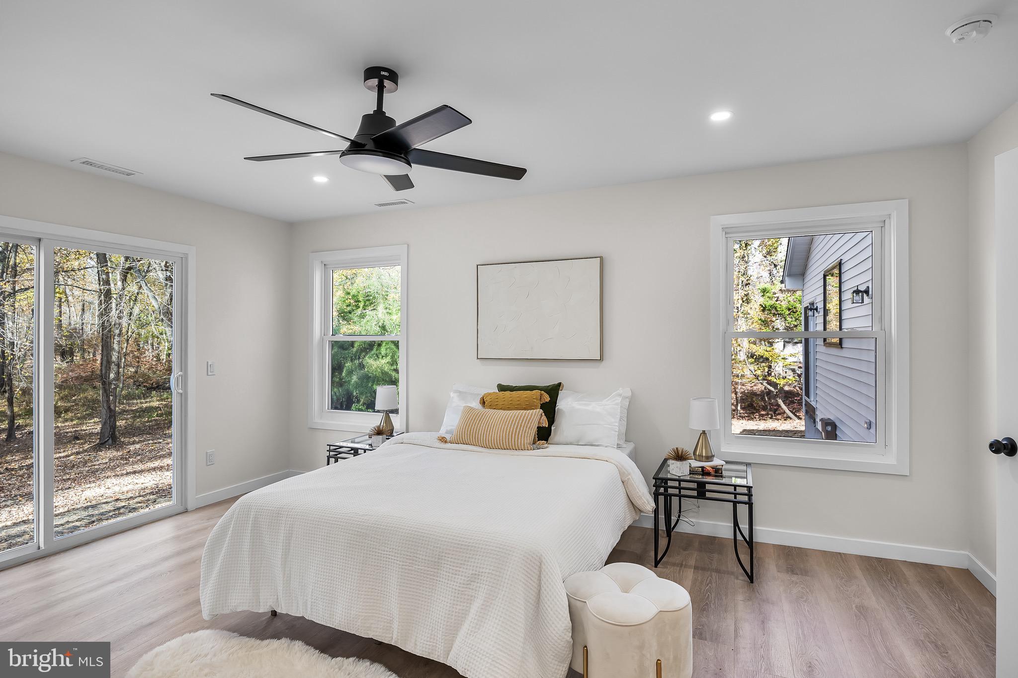 17 West Delaware Trail Medford, NJ 08055 - Photo 28 of 54 a bedroom with a bed and wooden floor