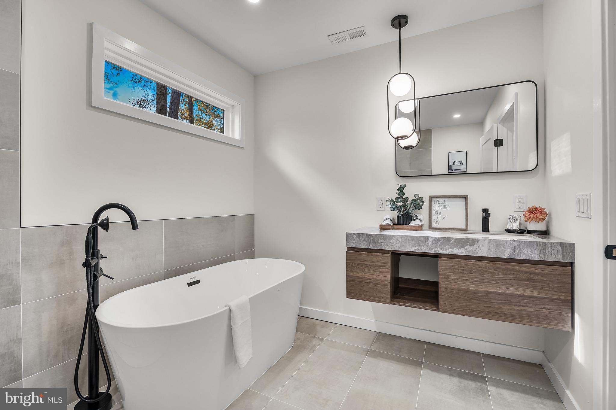 17 West Delaware Trail Medford, NJ 08055 - Photo 31 of 54 a spacious bathroom with a sink and a mirror