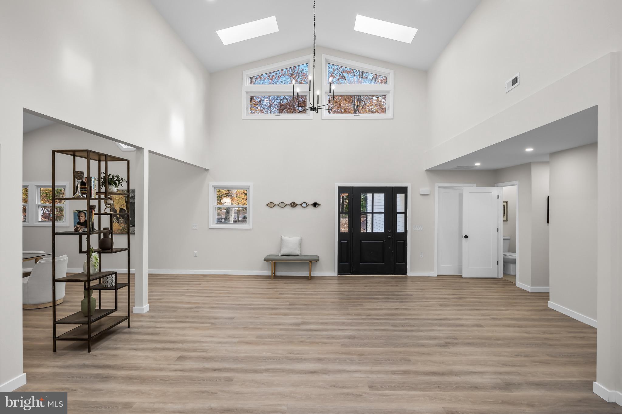 17 West Delaware Trail Medford, NJ 08055 - Photo 7 of 54 an empty room with wooden floor and windows