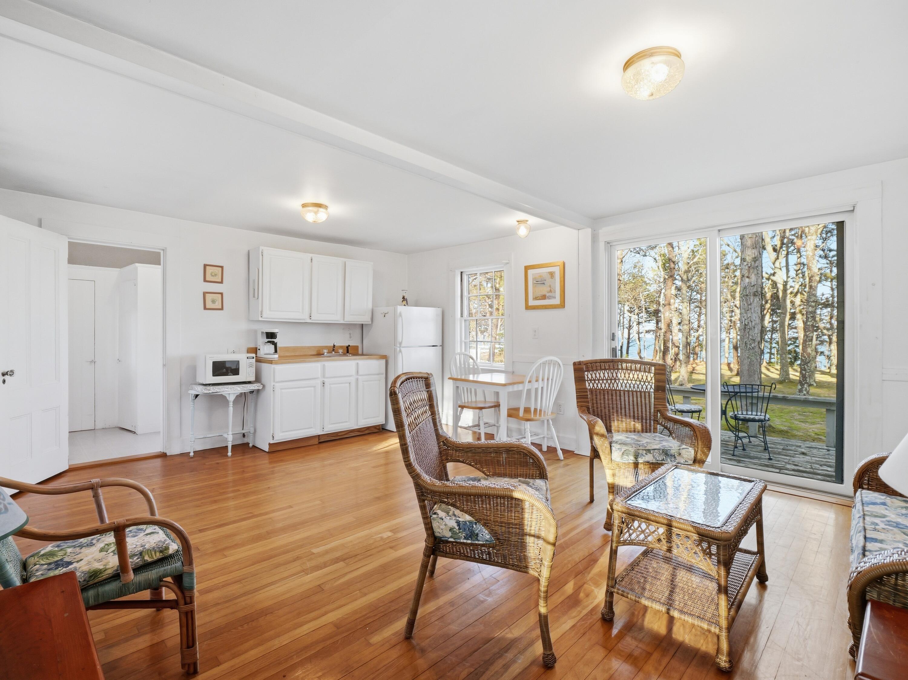 190 Vineyard Road Cotuit, MA 02635 - Photo 32 of 41 a living room with furniture and kitchen view