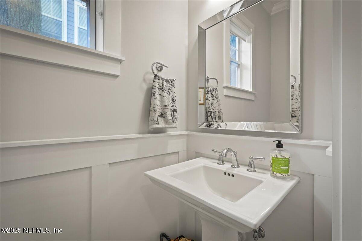 740 Paradise Lane Atlantic Beach, FL 32233 - Photo 20 of 38 a bathroom with a sink and a mirror