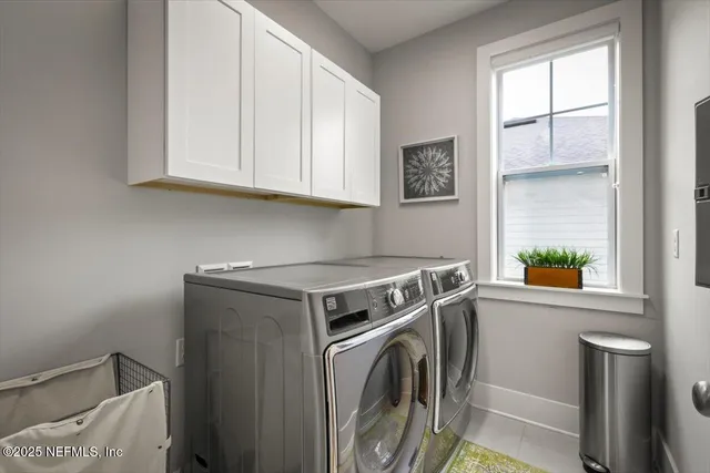a bathroom with a sink double vanity granite tub shower and a mirror