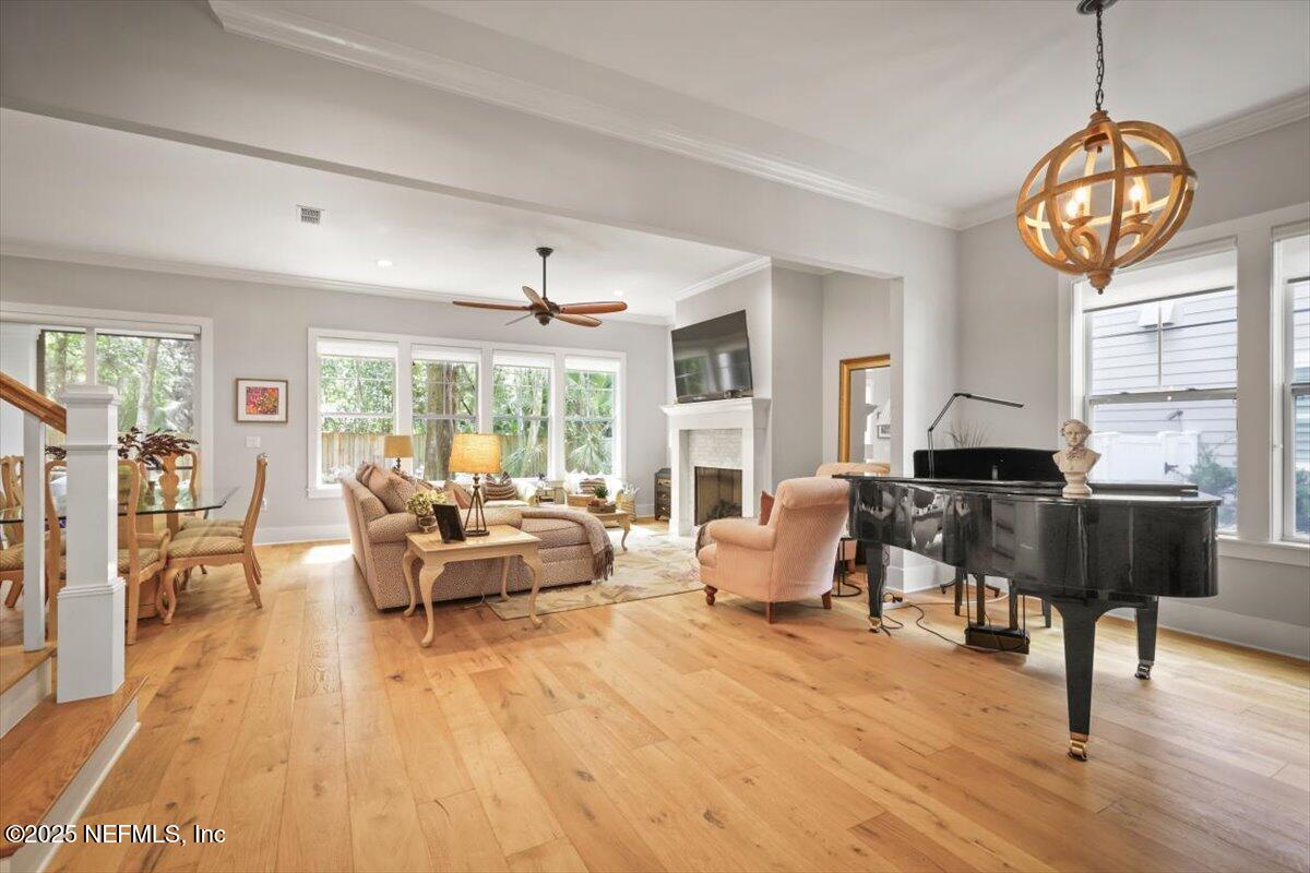 740 Paradise Lane Atlantic Beach, FL 32233 - Photo 5 of 38 a living room with furniture a fireplace and a large window