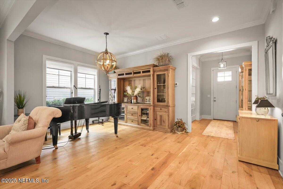740 Paradise Lane Atlantic Beach, FL 32233 - Photo 6 of 38 a living room with furniture and a chandelier