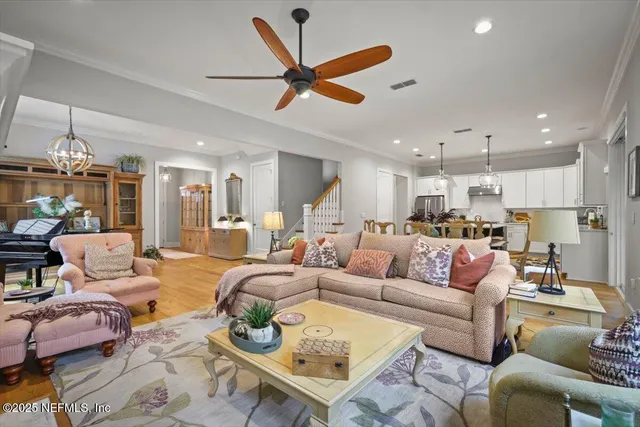 a living room with fireplace furniture and a flat screen tv