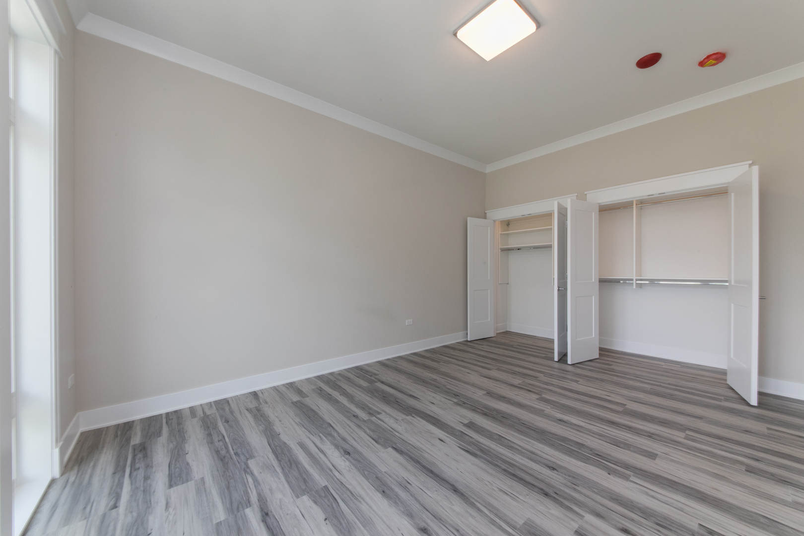 1116 Courtland Avenue, Unit 203 Park Ridge, IL 60068 - Photo 11 of 16 a view of an empty room with wooden floor and closet