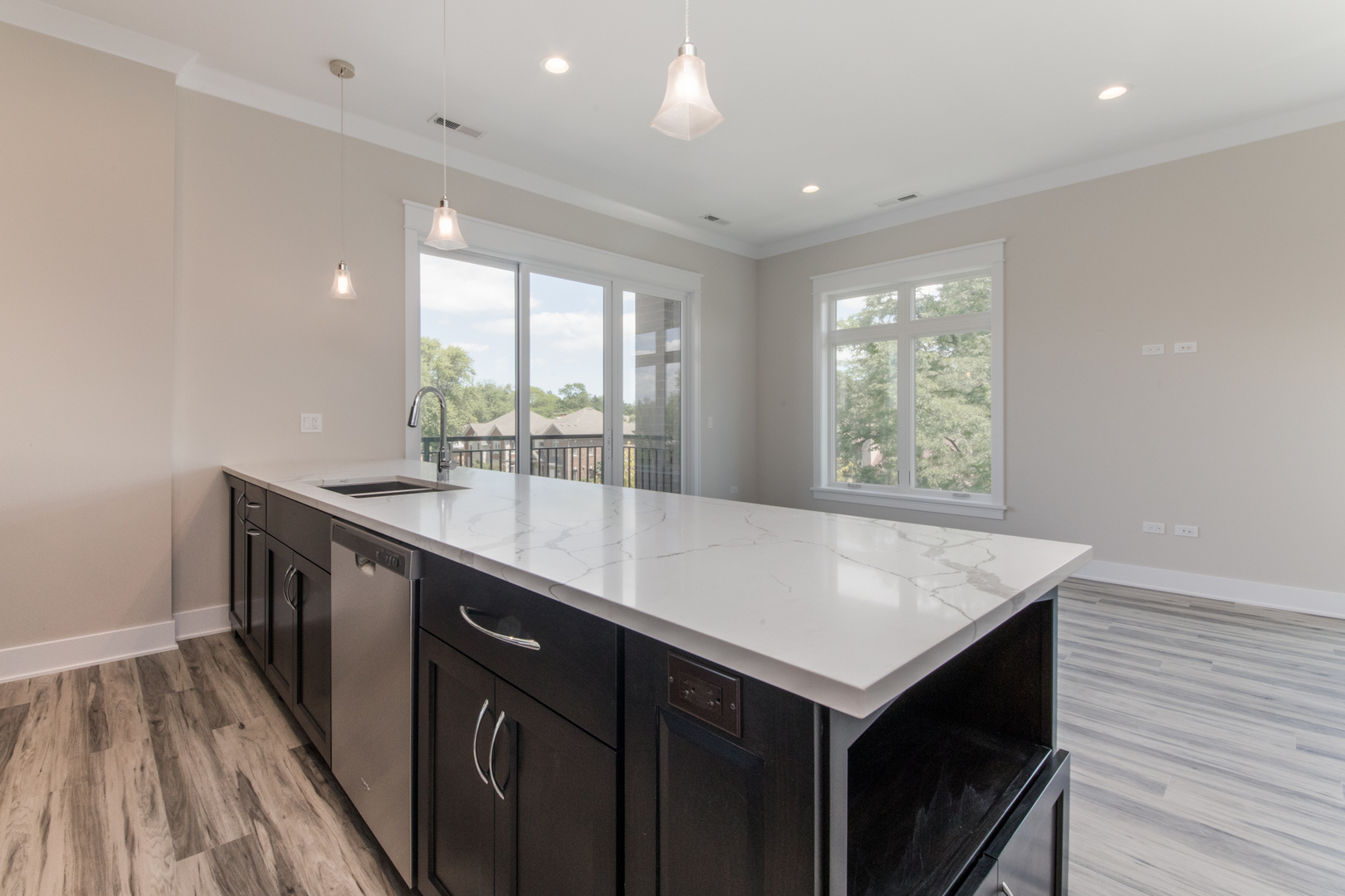 1116 Courtland Avenue, Unit 203 Park Ridge, IL 60068 - Photo 5 of 16 a kitchen with a stove a sink and a refrigerator