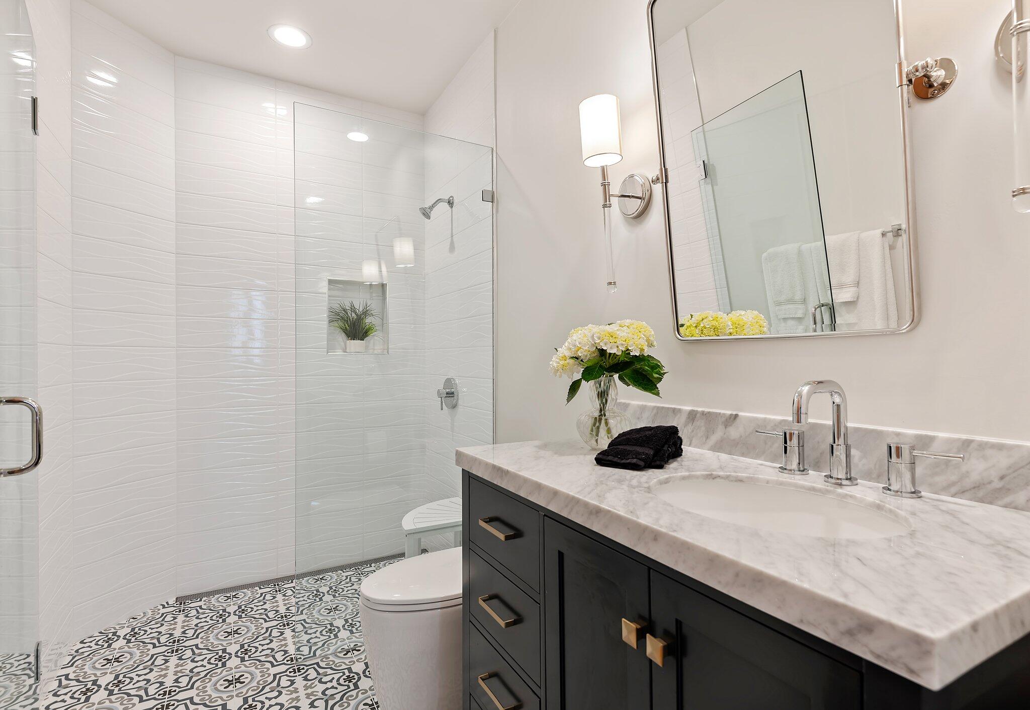 130 Via Alicia Santa Barbara, CA 93108 - Photo 14 of 16 a bathroom with a granite countertop sink a toilet and shower