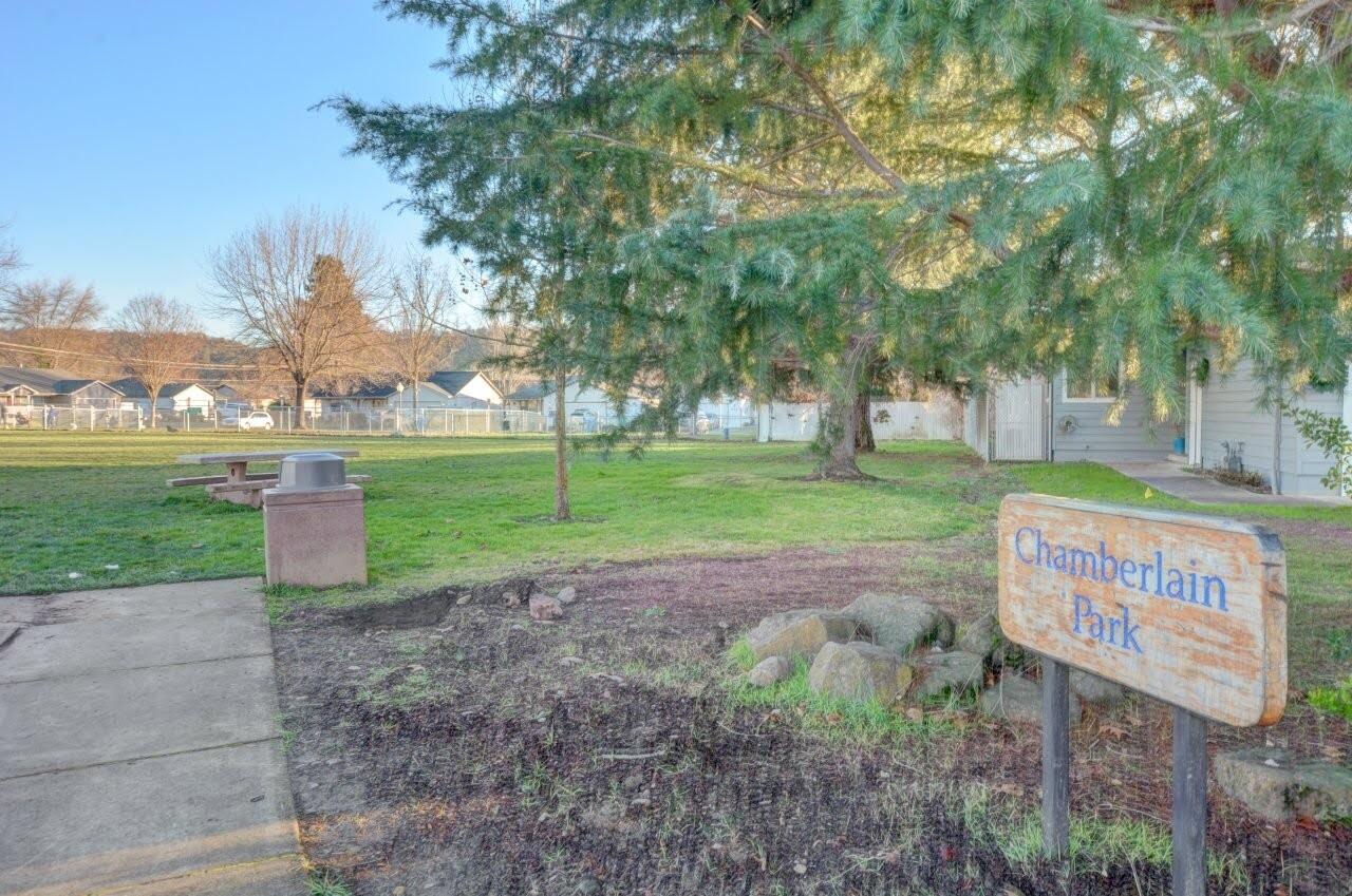 417 Crystal Drive Eagle Point, OR 97524 - Photo 32 of 35 a sign board with empty space and trees in the background