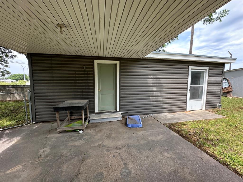 7350 Highway 67, Unit 377N Comanche, TX 76442 - Photo 13 of 13 a front view of a house with garden