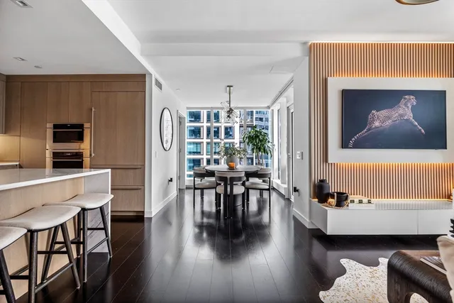 a view of a livingroom with furniture and a flat screen tv