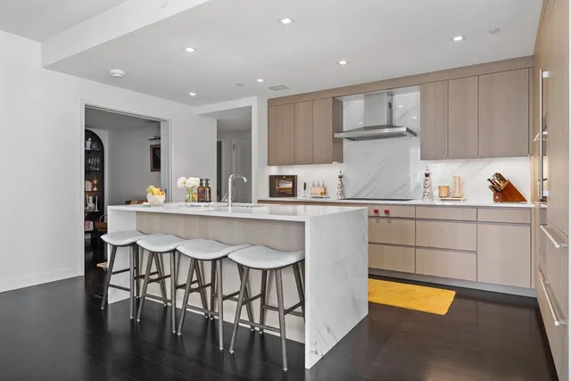 a kitchen with a sink a stove a refrigerator and cabinets