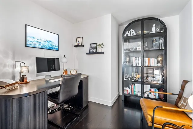 a view of a workspace with furniture and a workspace