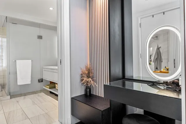 a view of a room with furniture and wooden floor