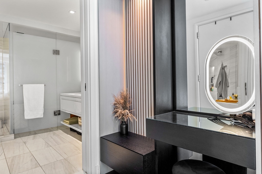 150 Seaport Boulevard, Unit 14B Boston, MA 02210 - Photo 20 of 42 a view of a room with furniture and wooden floor